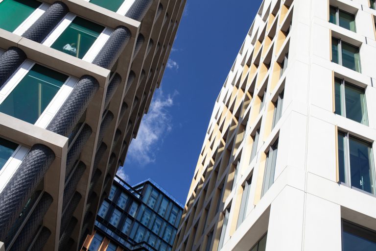 High-rise buildings with a blue sky behind them