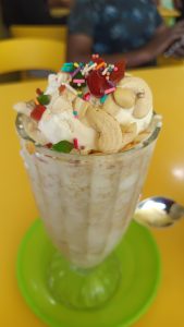 Tender avilmilk. Dessert cup with coconut milk, banana and nuts
