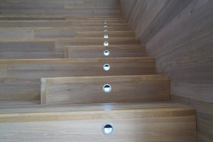 Wooden stairs with led lights on the steps