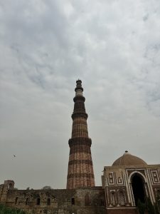 Qutub Minar, a victory tower, stands tall in Delhi, India, showcasing magnificent architecture and rich history.
