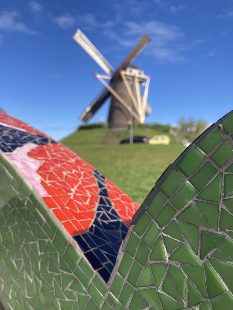 mill with mosaic shape in front of the picture