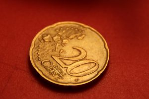 Macro photo of a 20 eurocent coin on a red background