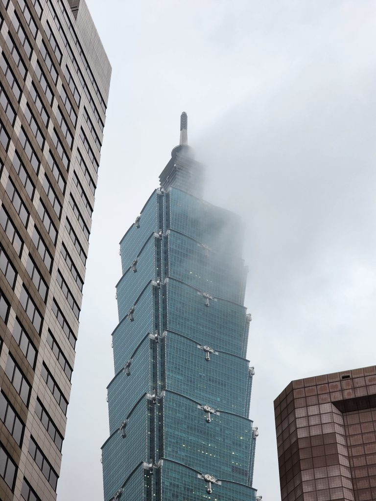 Taipei 101 building covered with fog.