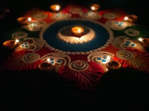 diwali diya – candles and sand mandala 
