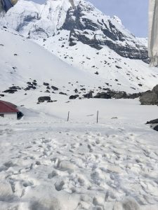 A popular travel destination of Nepal called Annapurna Base Camp. The entire mountain is covered with snow. 