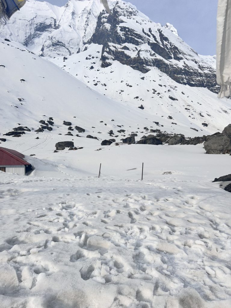 A popular travel destination of Nepal called Annapurna Base Camp. The entire mountain is covered with snow.