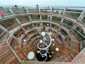 Spiral walkway to the top of a structure overlooking trees