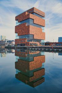 MAS museum in Antwerp with reflections in water