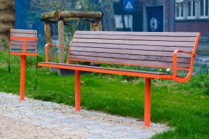 A bench with a small bench next to it specific for kids.