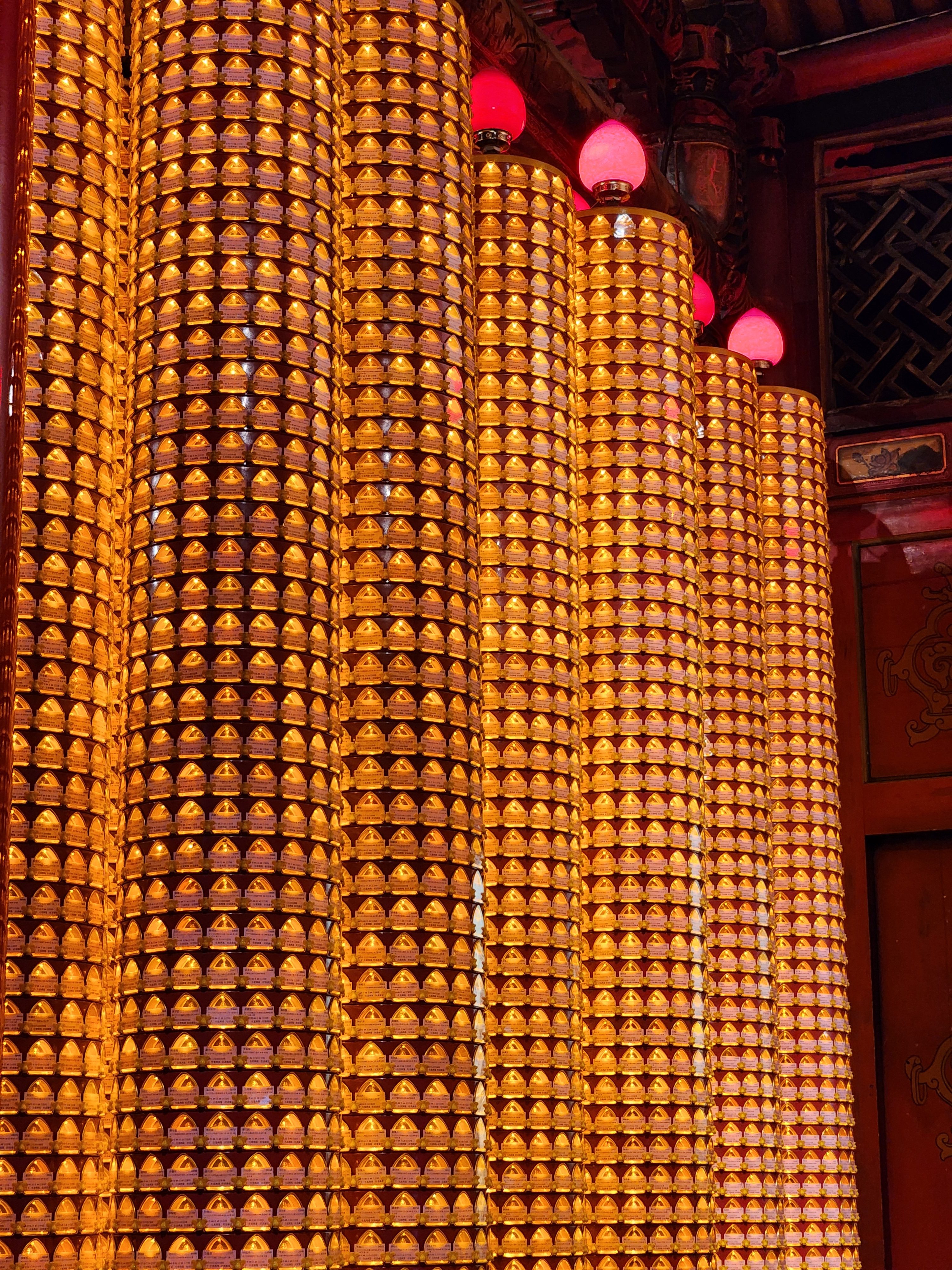 Pillars with string of lamps in the temple at Taipei.