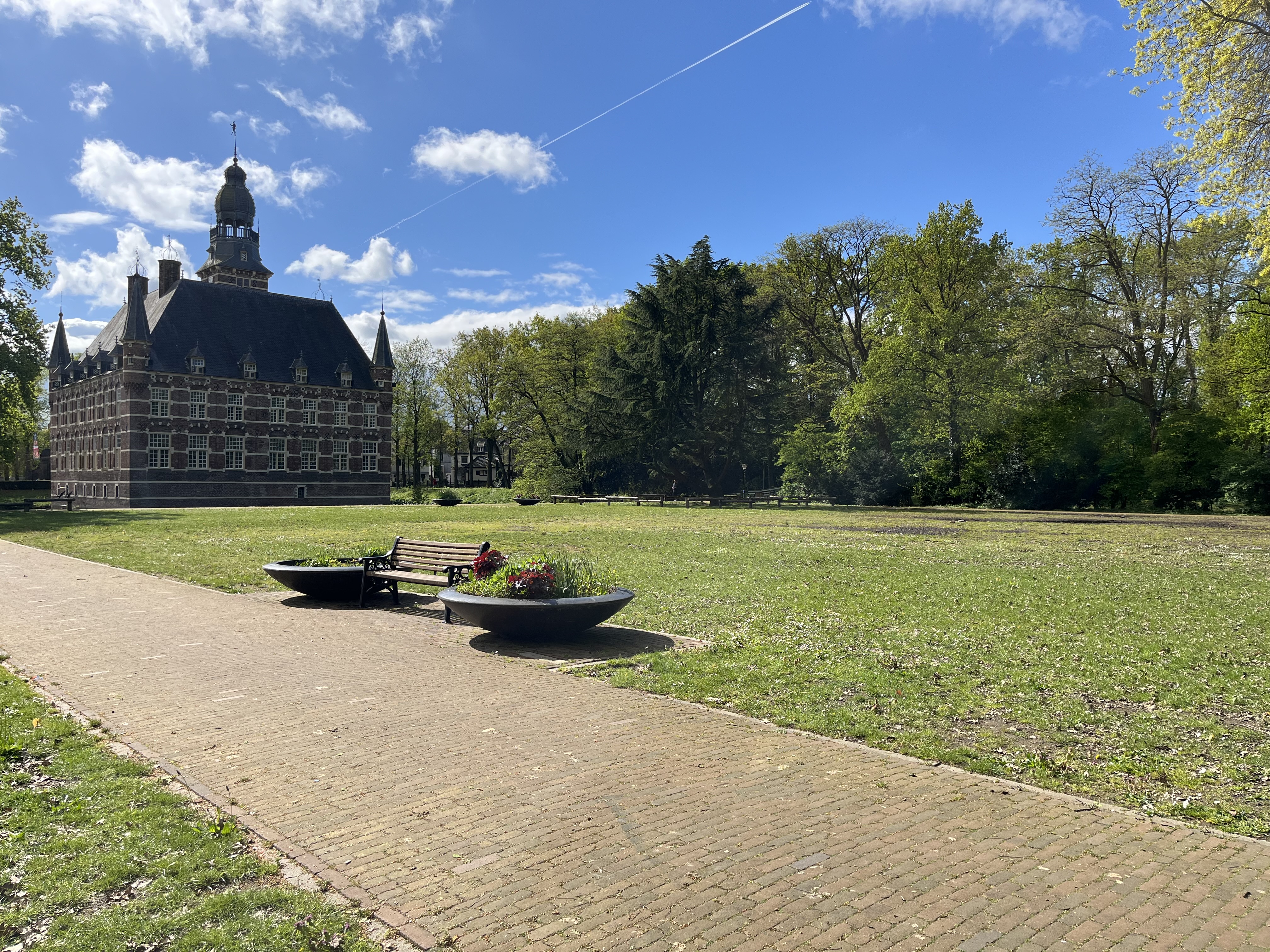 The garden of the Wijchen Castle, the Netherlands, with blue sky and some small clouds