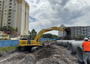 Komatsu PC360LC excavator laying drainage pipes in Orlando, Florida.