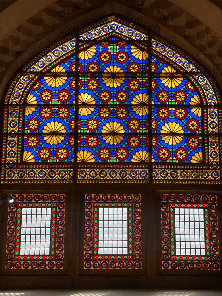 Stained glass windows in the Divankhaneh mansion located in Shiraz near KarimKhan Zand Citadel inside the 2nd hall in front of fireplace.