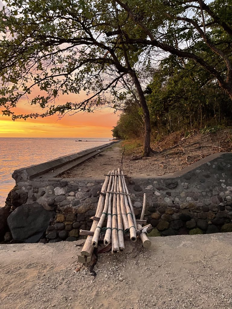 sunset on the seaside with a bamboo bridge