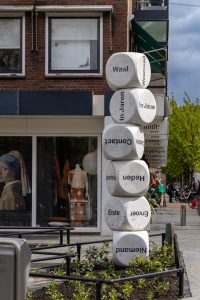 Cubes with Dutch words, stacked in a street in a street in Wijchen, The Netherlands