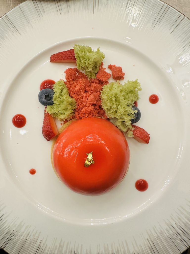 Fully decorated dinner plate in a restaurant.