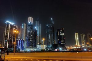 Dubai's dazzling cityscape at night, ablaze with illuminated buildings.