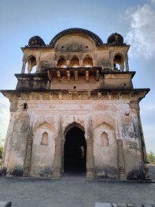 An ancient architectural structure with a domed roof and intricate carvings, inviting visitors to explore its historical significance and grandeur.
