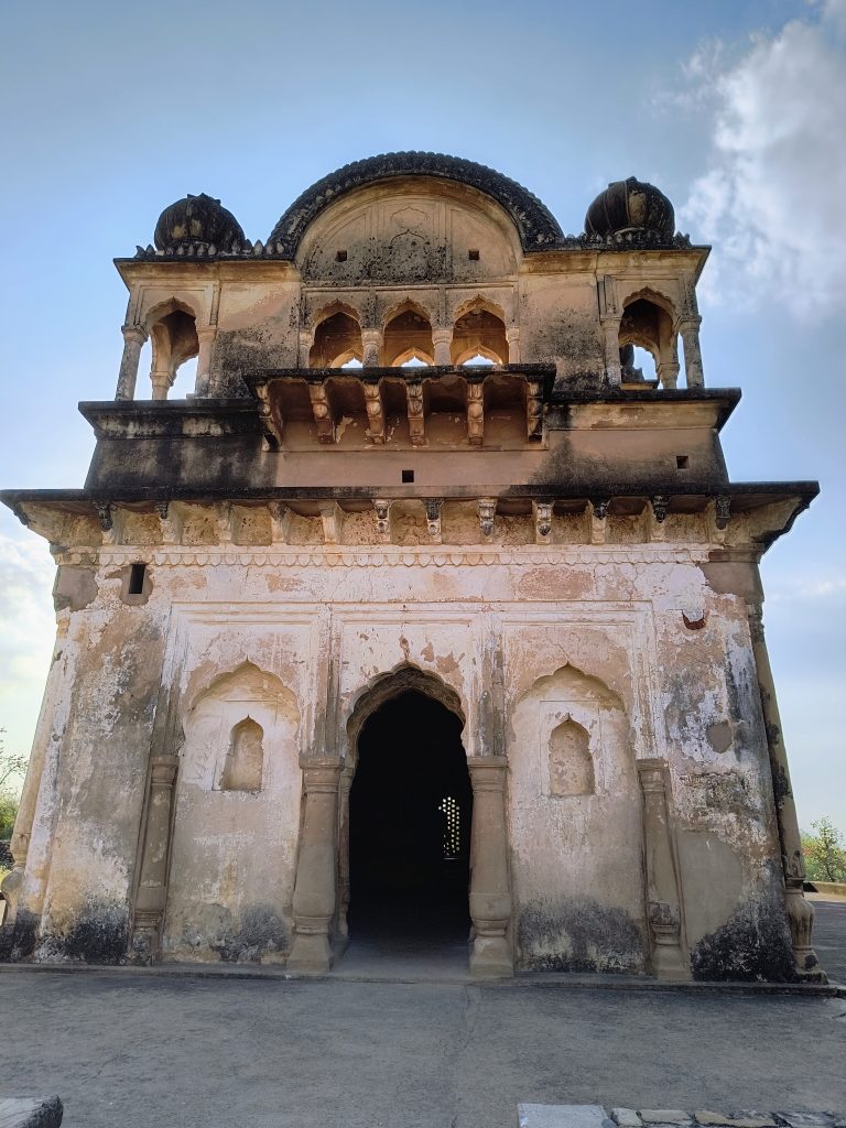 An ancient architectural structure with a domed roof and intricate carvings, inviting visitors to explore its historical significance and grandeur.
