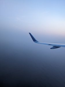 Blue sky and a view of the blue sea from the aeroplane.