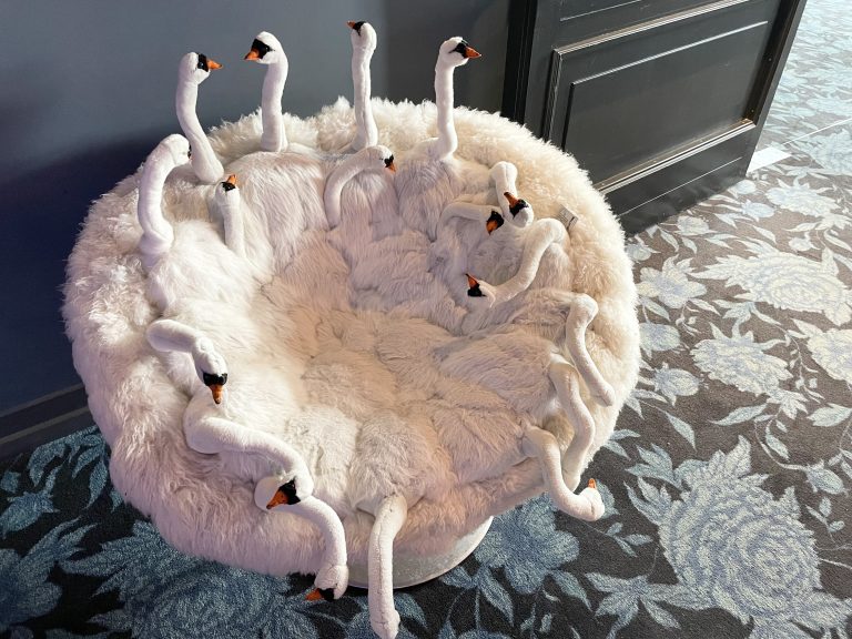 A round chair of a hotel designed as a group of swans. From Munich, Germany.