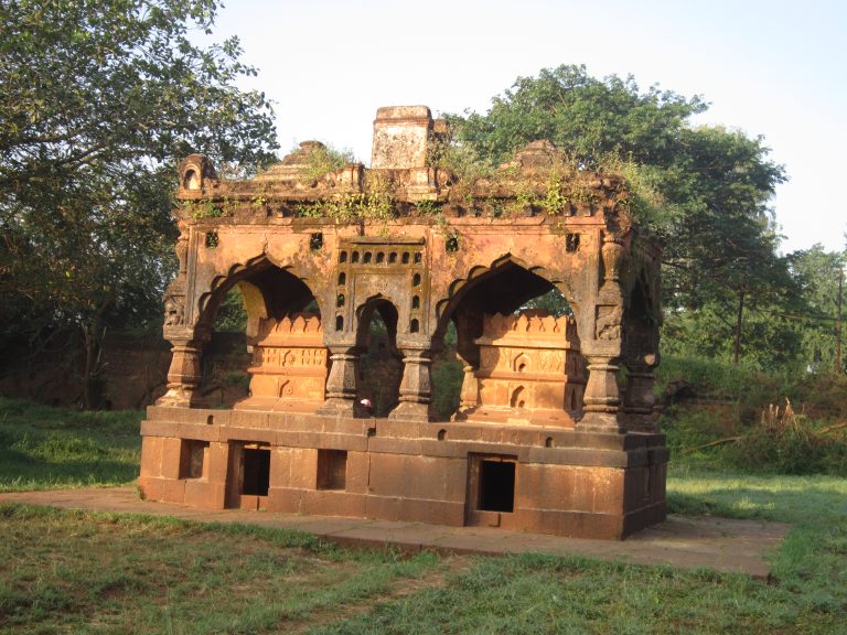 A historical building surrounded by lush trees at Panchganga Ghat Kolhapur.