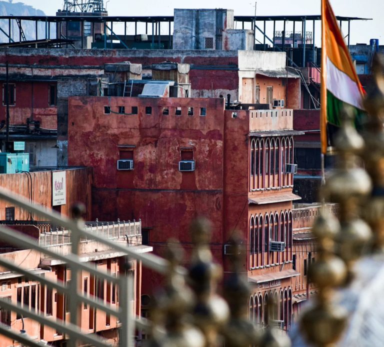 Aerial view of Jaipur with a flag of the Royal Family in the front