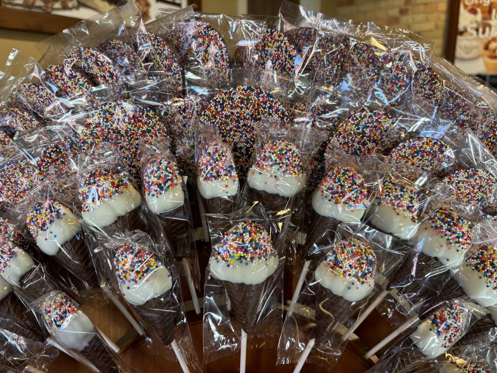 Bouquet of ice cream cone shaped chocolates with sprinkles on them.