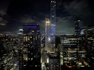 Evening skyline with lots of office lights aglow across buildings large and small (Midtown Manhattan, New York)
