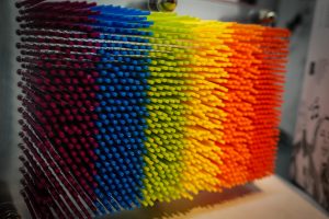 View larger photo: Desktop toy consisting of hundreds of rainbow-colored sticks