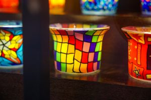 View larger photo: Stained glass candle pot with the colors of the rainbow.