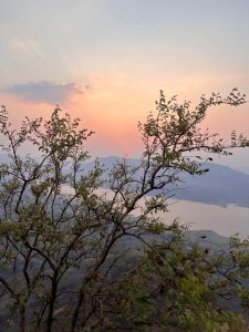 Photo of a summer sunset from a cliff in Panchgani, India overlooking the Krishna River