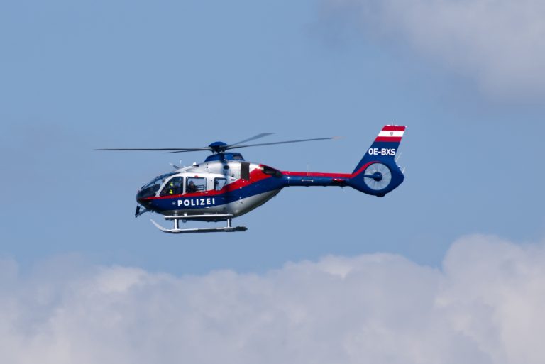 Austrian police helicopter against a blue sky