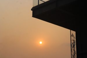 A sunset with an orange sky, viewed from Dhaka Boat Club
