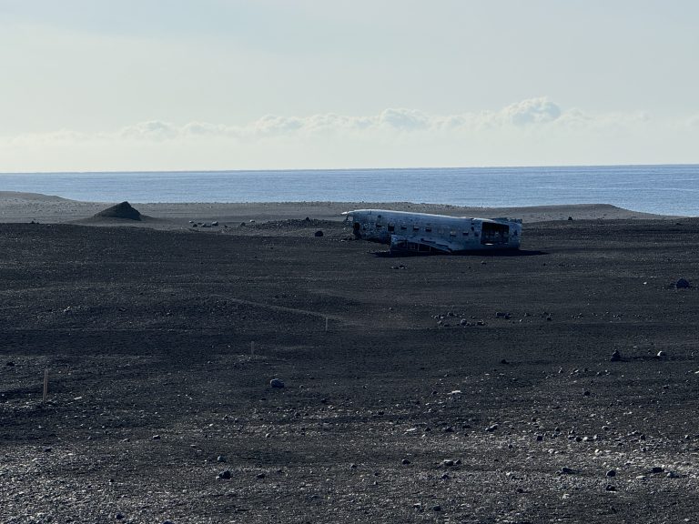 Airplane wreckage by the beach in Iceland.