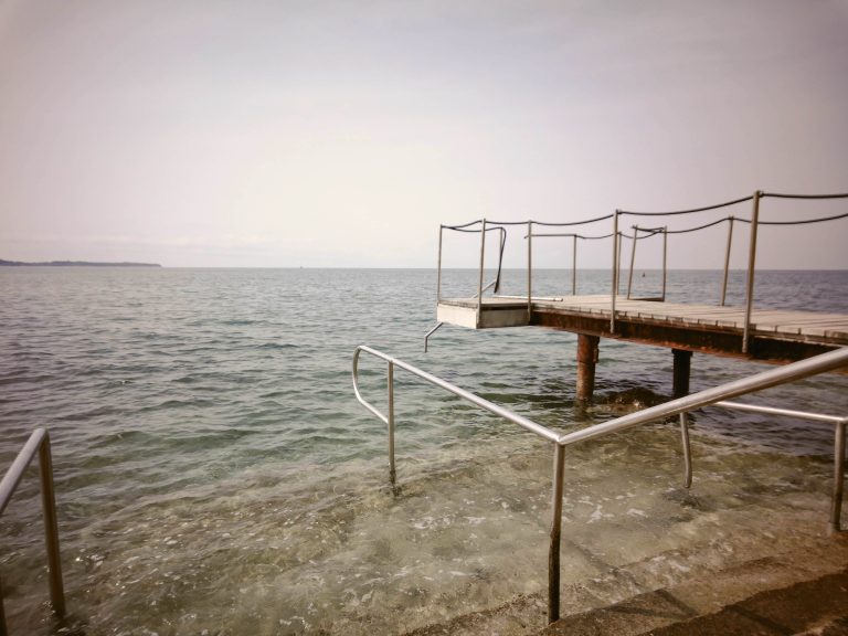 Pier over water leading from the right to the center of the photo. (in-camera filter)