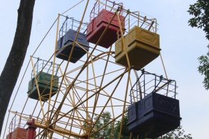 View larger photo: Looking up toward the sky through a small ferris wheel