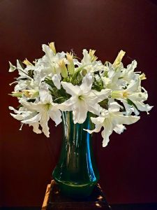 View larger photo: A flower vase with white flowers in a dark room. From Kunsthistorisches Museum, Vienna, Austria.