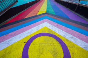 View larger photo: Intersex variant of the Progress Pride Flag painted on a city street