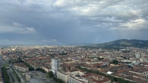 View larger photo: Turin Italy from above with a rainbow in the distance