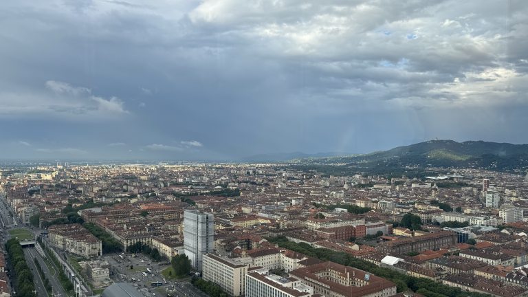 Turin Italy from above with a rainbow in the distance