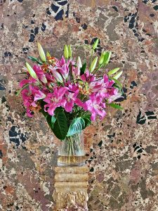 A flower vase with marble wall background. From Kunsthistorisches Museum, Vienna, Austria.