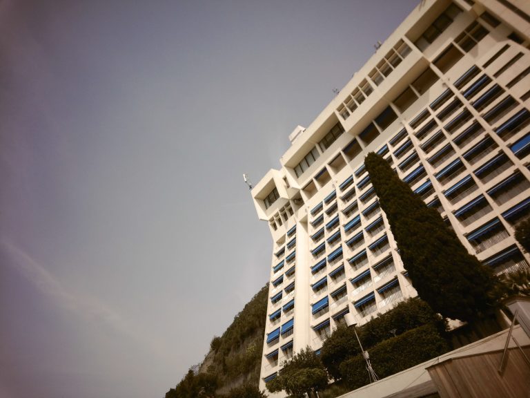 Hotel building with a blue sky in the background.