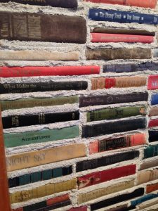 Book spines stacked like bricks with mortar between then (Literati Cafe, Los Angeles, California)