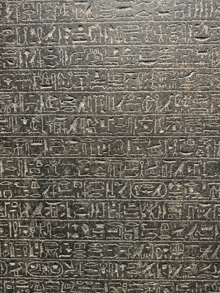 A straight on view of a stone covered in hieroglyphics as seen at the Museo Egizio in Turin, Italy.