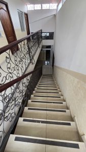 Looking down a stairwell indoors. 