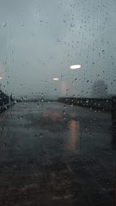 View larger photo: Raindrops on a glass window. Light shadow on the window 