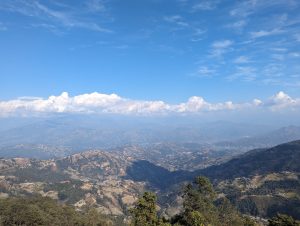 A view of Himalayan range from Nagarkot, Nepal. The sky is clear and clouds are just above the hills. 