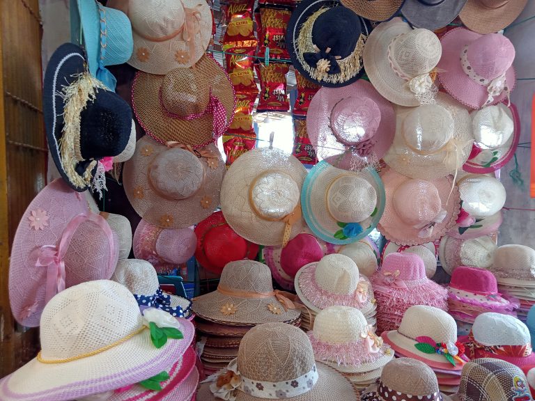 Dozens of hats, mostly straw, mostly pink, Cox’s Bazar, Bangladesh