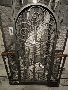 Ornate iron door for a lift in Italy